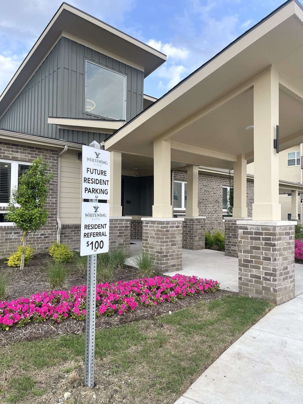 a house with a parking sign in front of it