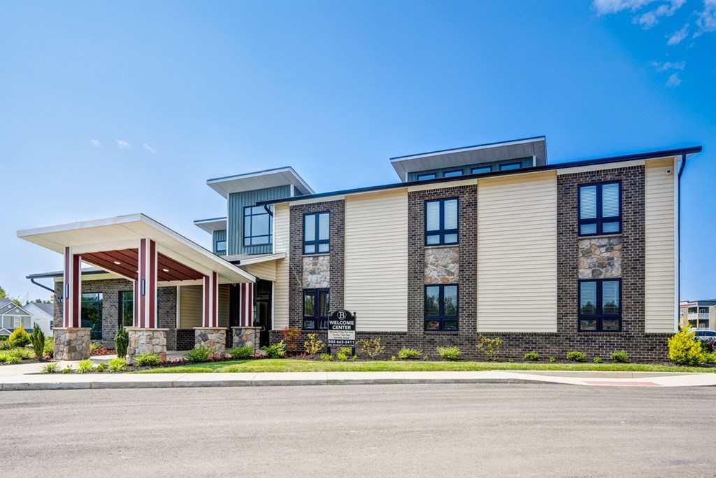 A modern two-story building with a mix of stone and siding exterior.