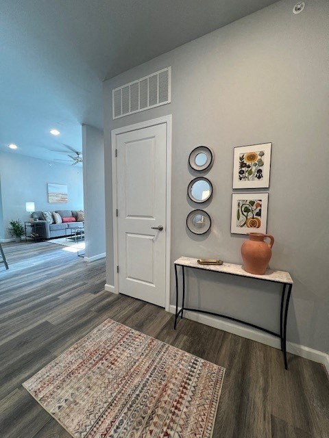 a hallway with a table and a white door