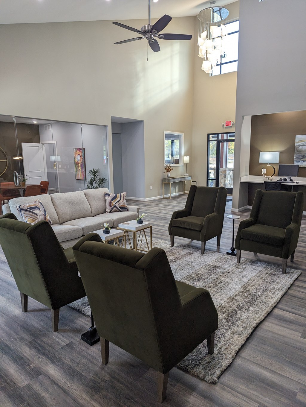 a living room with couches chairs and a rug
