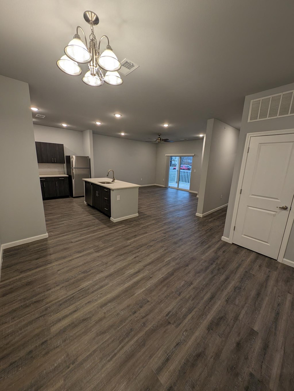 an empty living room and kitchen in a new home