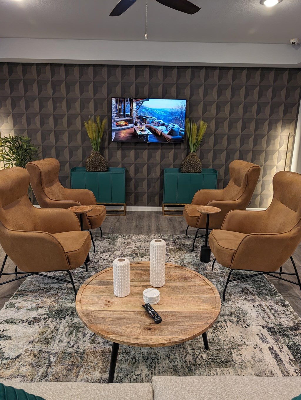 a living room with a table and chairs and a television