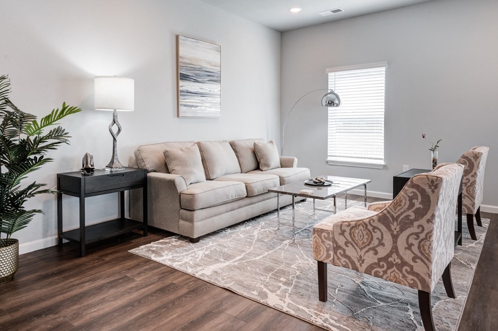 a living room with a couch and a chair