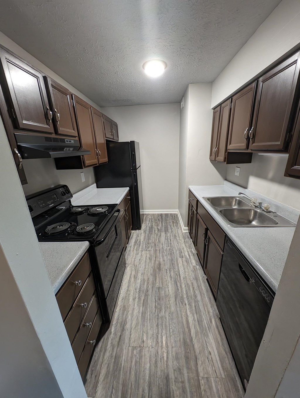 Galley Style Dark Wood Kitchen