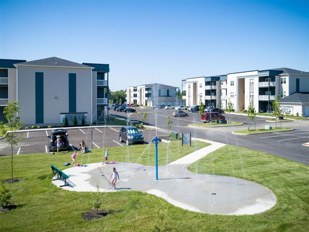 an aerial view of a city street with buildings