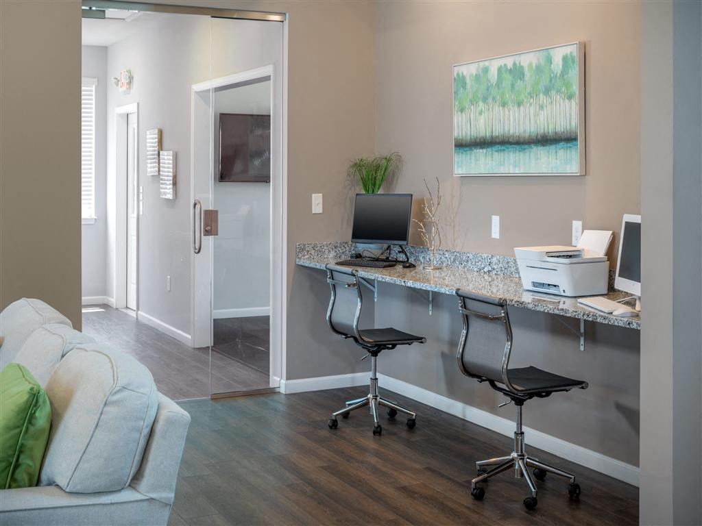 a home office with a desk and a computer