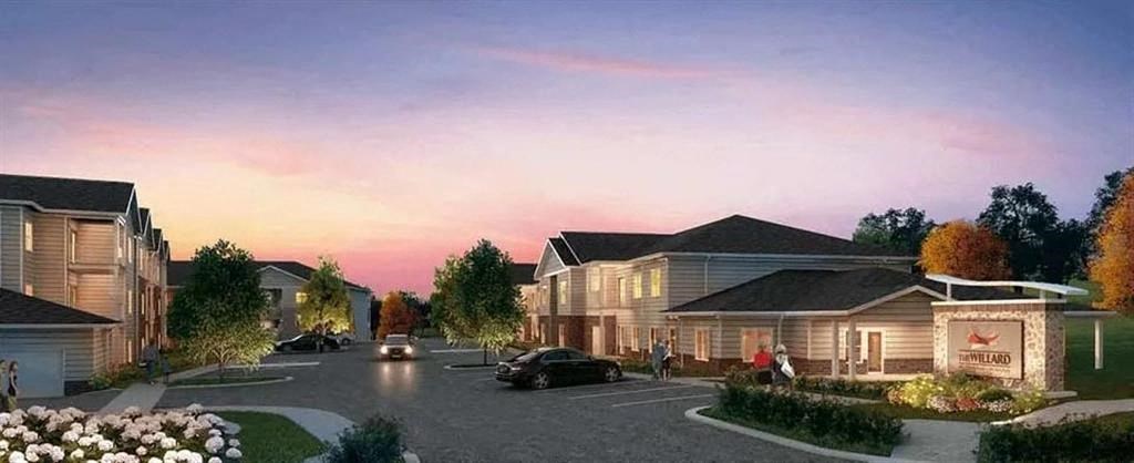 a street with cars parked in front of a house