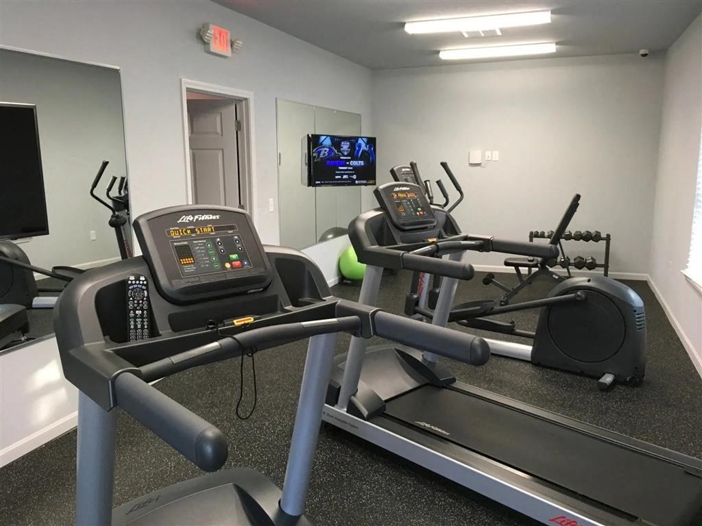 the gym in our new building is equipped with a treadmill and a tv