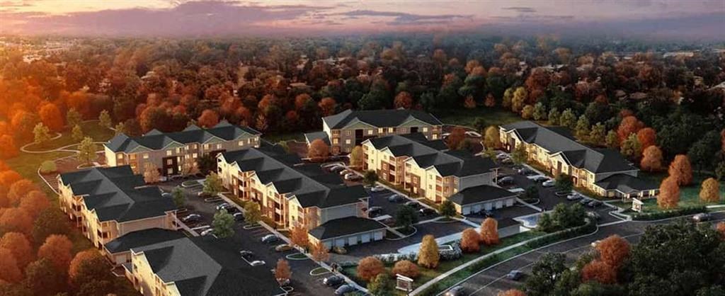 an aerial view of a neighborhood with houses and trees
