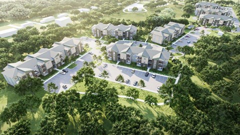 A bird's eye view of a residential area with houses and trees.