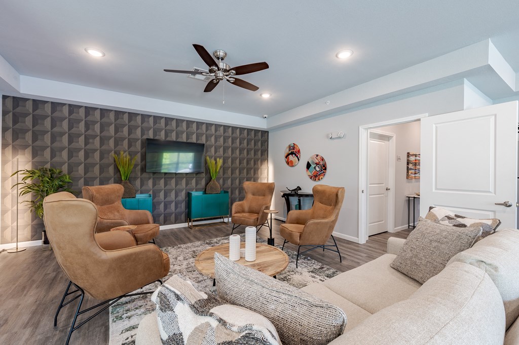 a living room with a couch and chairs