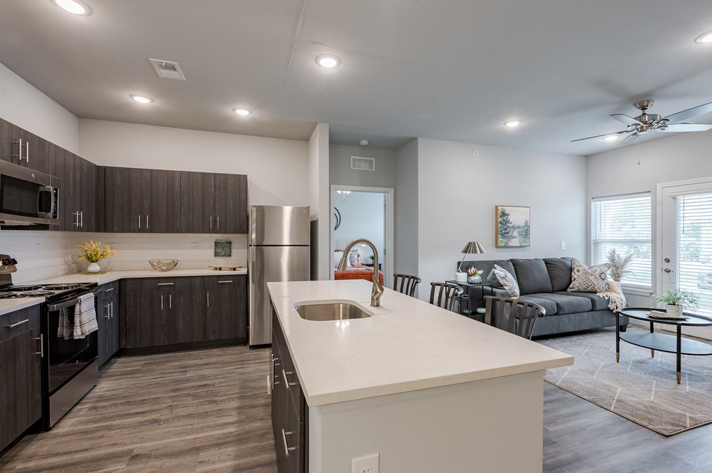 an open floor plan with a kitchen and living room