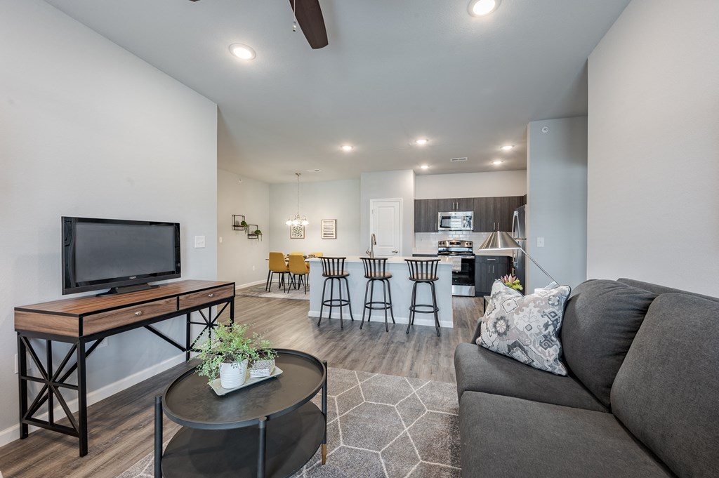 a living room with a couch and a table with a tv