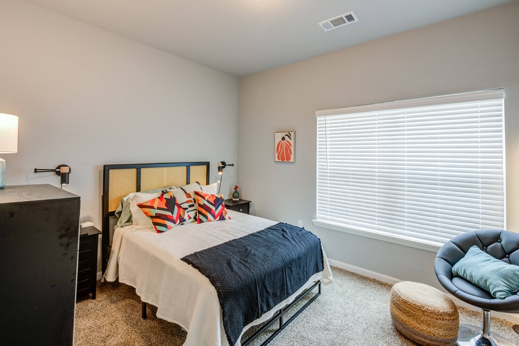 bedrooms with oversized windows at the preserve at great pond apartments in windsor tx