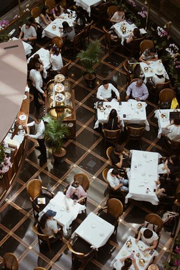 a restaurant with people sitting at tables