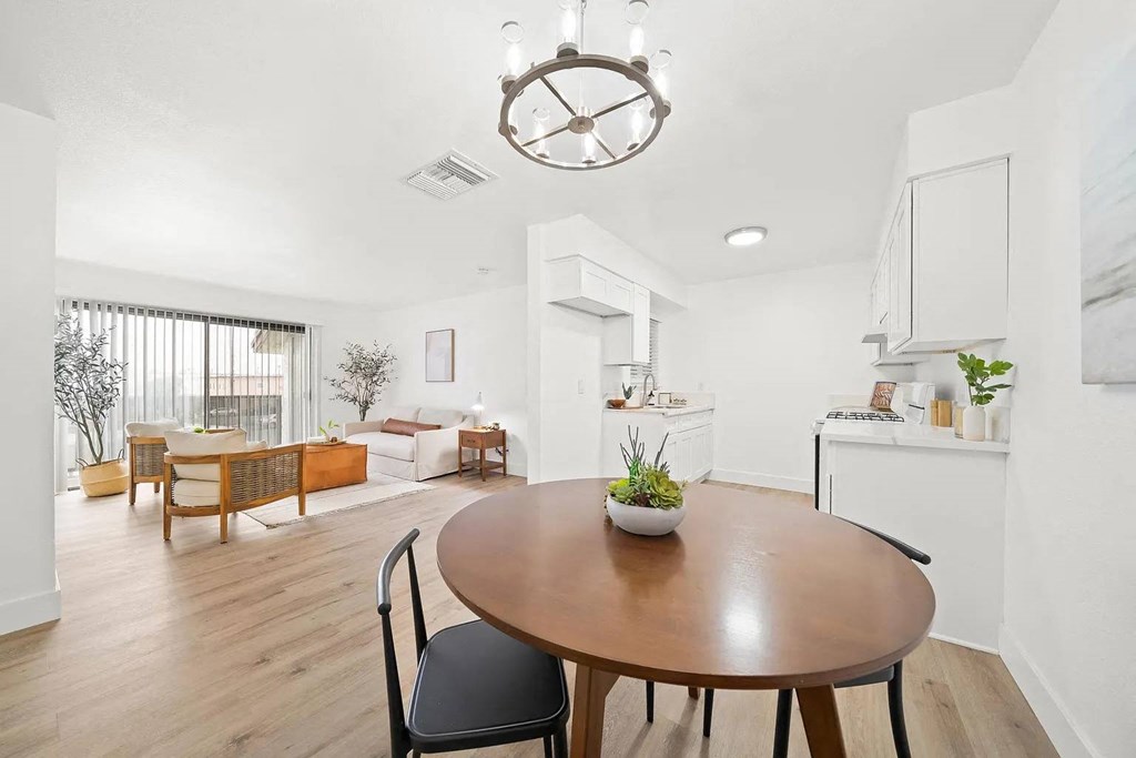 a dining room and living room with a table