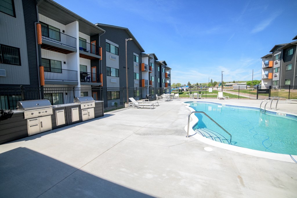 the pool at the conclusion of an apartment building with a swimming pool