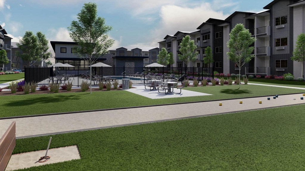 a rendering of a park with tables and chairs in front of an apartment building