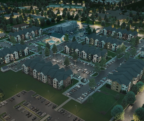 an aerial view of a neighborhood with houses and parking lot
