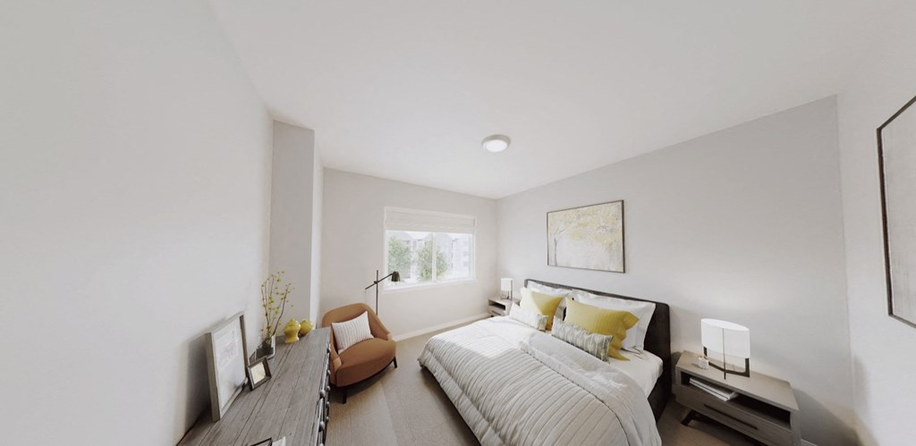 a bedroom with a large bed and a window