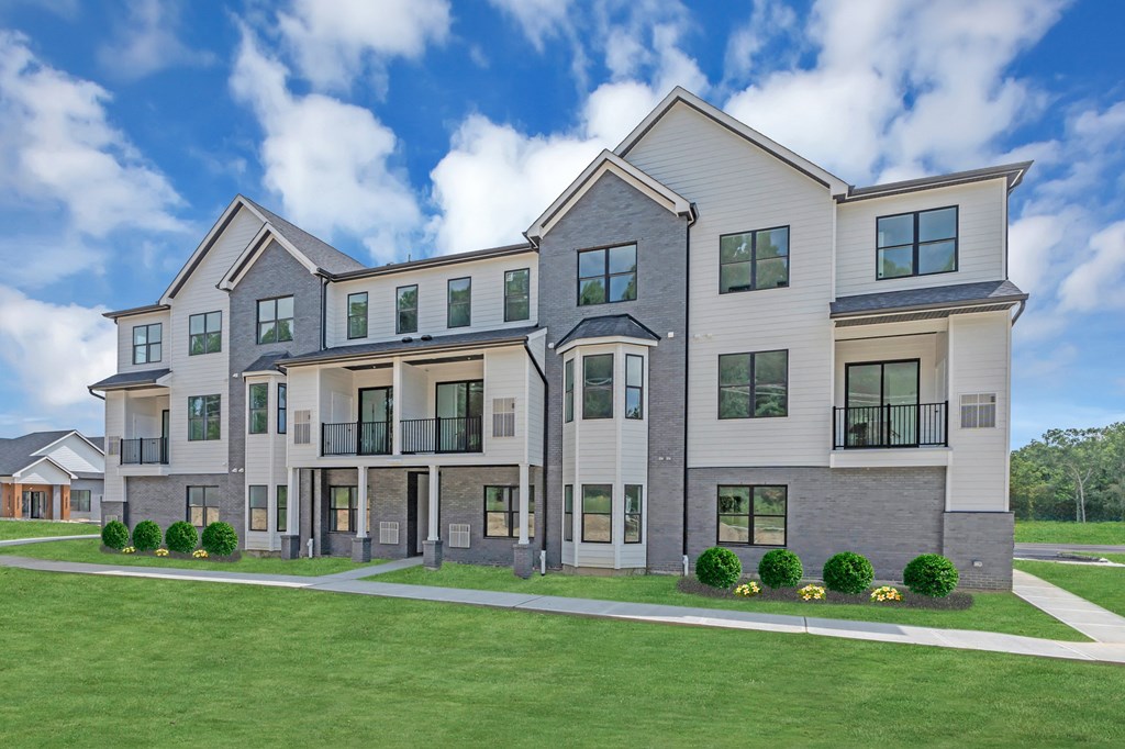 A modern two-story house with a large front yard at The Franklin Marlboro Apartments, Marlboro