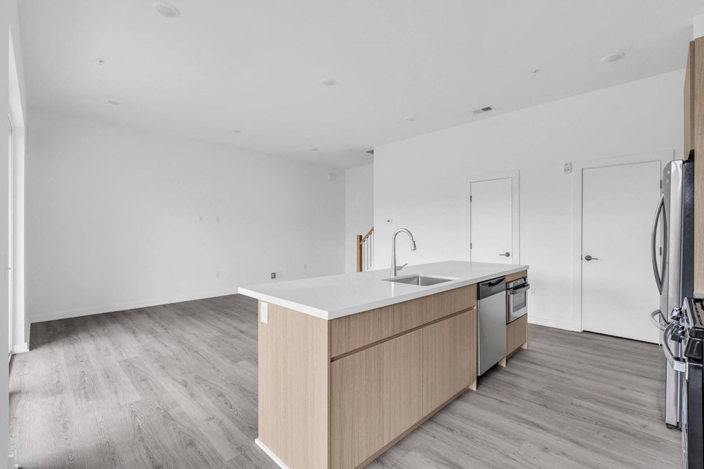 A kitchen with a sink, stove, and oven at The Franklin Marlboro Apartments, Marlboro
