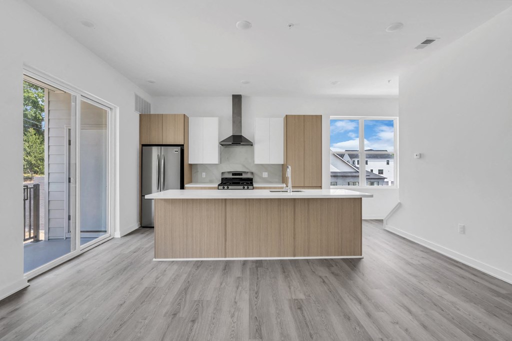 A modern kitchen with a wooden island and stainless steel appliances at The Franklin Marlboro Apartments, Marlboro, NJ 07746