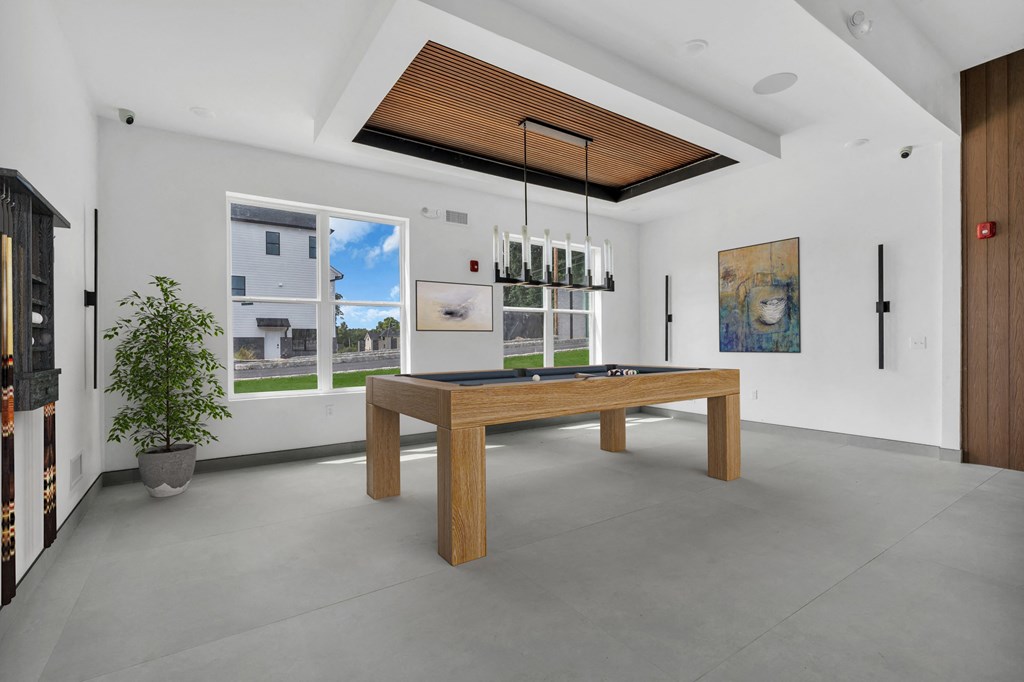 a large room with a ping pong table in the middle of it at The Franklin Marlboro Apartments, New Jersey