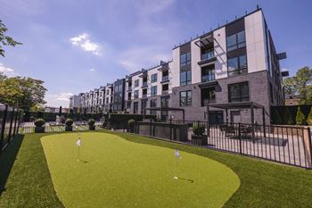 a putting green in front of a building