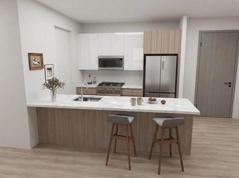 A kitchen with a white countertop and wooden bar stools.