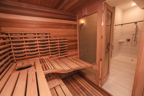 A sauna with wooden benches and a glass door.at The Franklin at Westfield, New Jersey, 07090