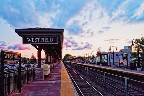 A train station named Westfield with a train on the tracks.at The Franklin at Westfield, New Jersey, 07090