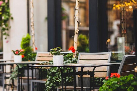 A table with chairs and a vase of flowers on it.at The Franklin at Westfield, Westfield, NJ 07090