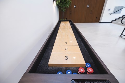 A shuffleboard game at The Franklin at Westfield, New Jersey