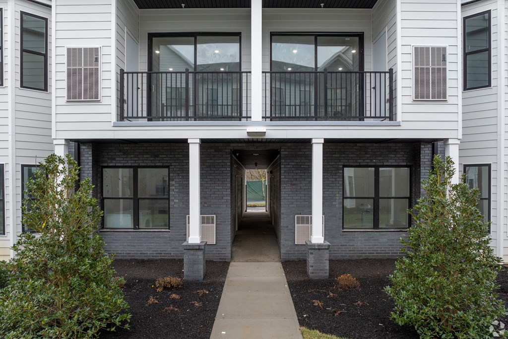 A white two-story building with a balcony at The Franklin at Marlboro, Marlboro, NJ, 07746