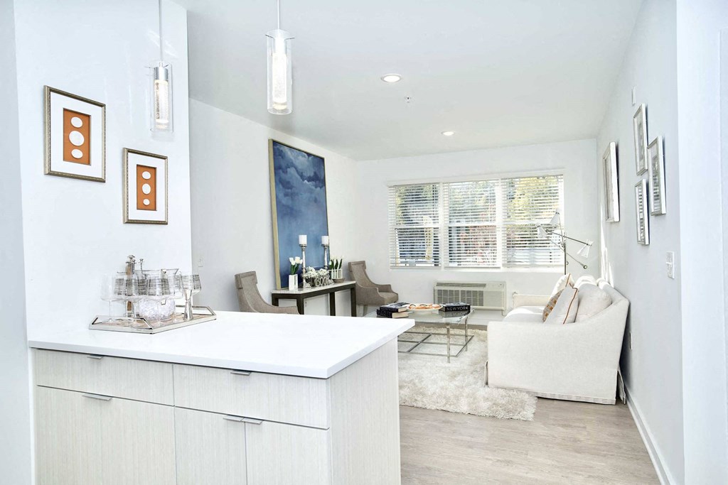 a white living room with a white counter top