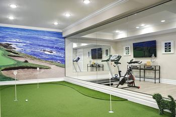a home gym with a view of the ocean