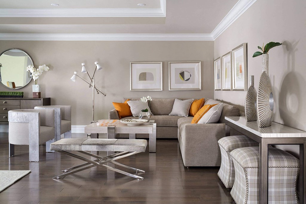 a living room with couches and chairs and a table