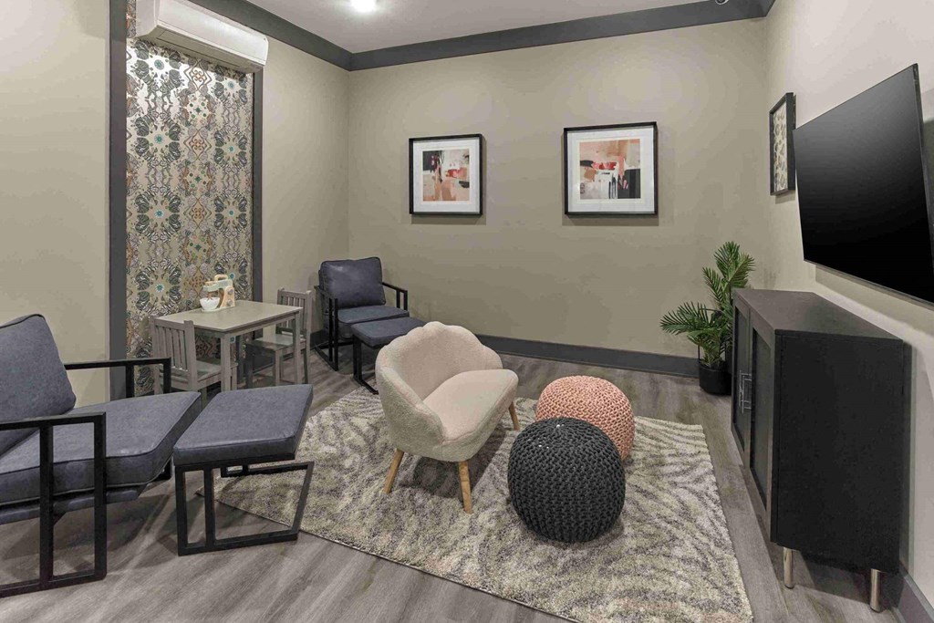 a rendering of a living room with chairs and a television