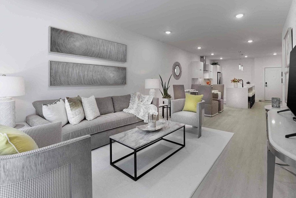 a view of a living room from the top of a staircase