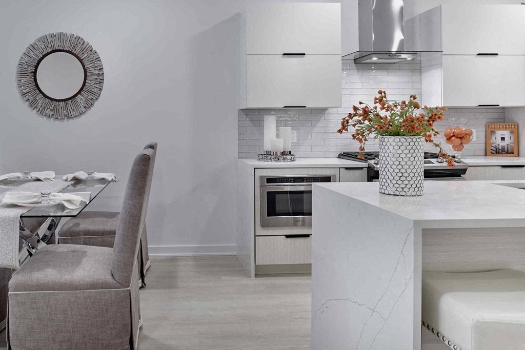 a kitchen with a marble counter top and a table
