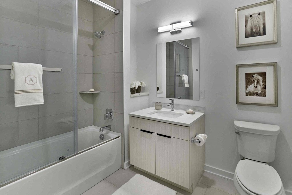 a bathroom with a sink toilet and a shower