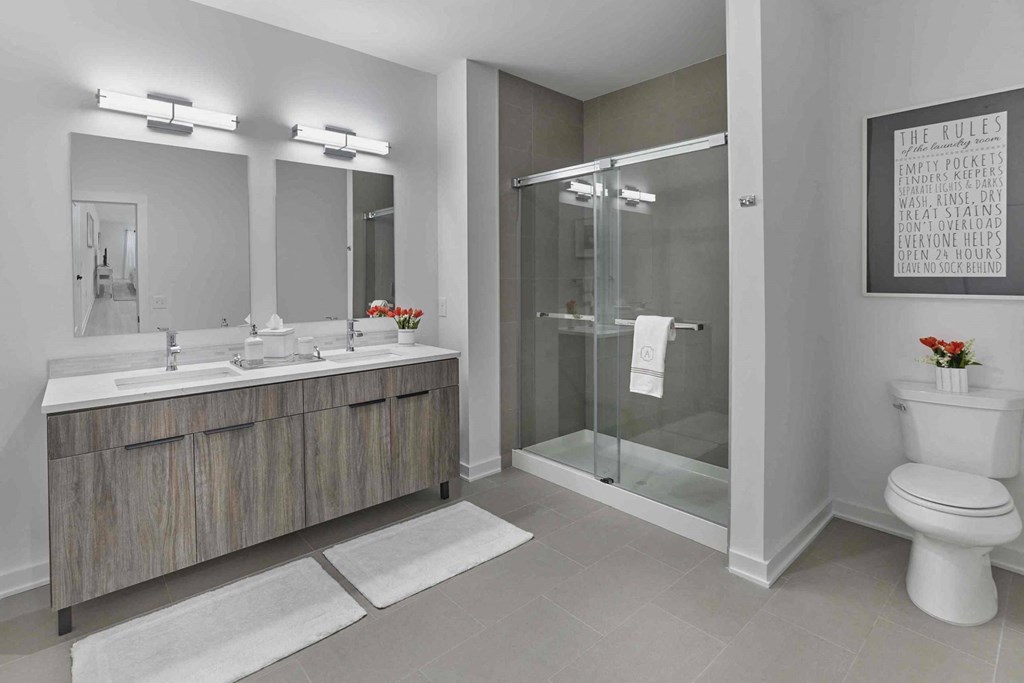 a bathroom with a toilet sink and shower