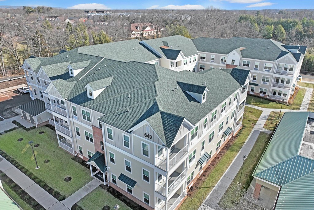 an aerial view of an apartment building with green roofs