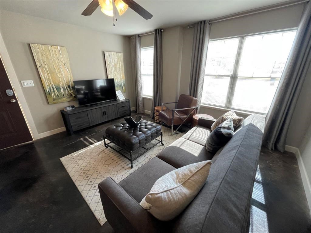 Living Area With Ceiling Fan at Palisades at Pleasant Crossing, Rogers