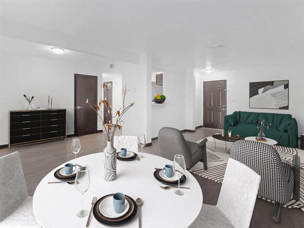 a living room and dining room with a white table and chairs