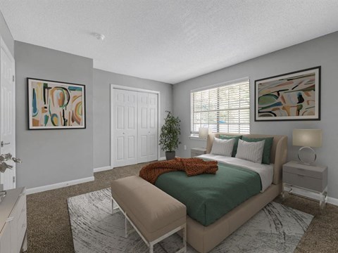 a bedroom with gray walls and a green bed