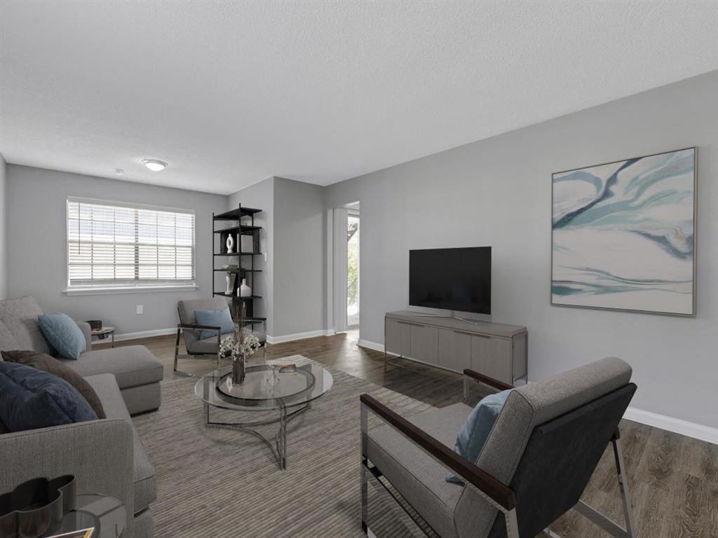 a living room with a couch and a television