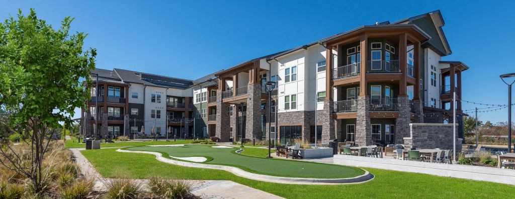 a building with a mini golf course in front of it at Fitzroy Grove, Rogers, AR, 72758