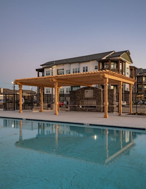 a building with a pool in front of it